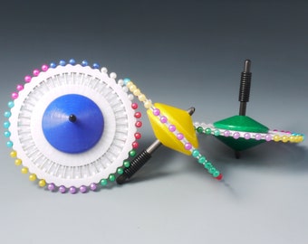 Spinning top “Needle carousel”