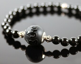 Armband für Männer in grau und schwarz Hämatitkorne und tibetischen Perlen 