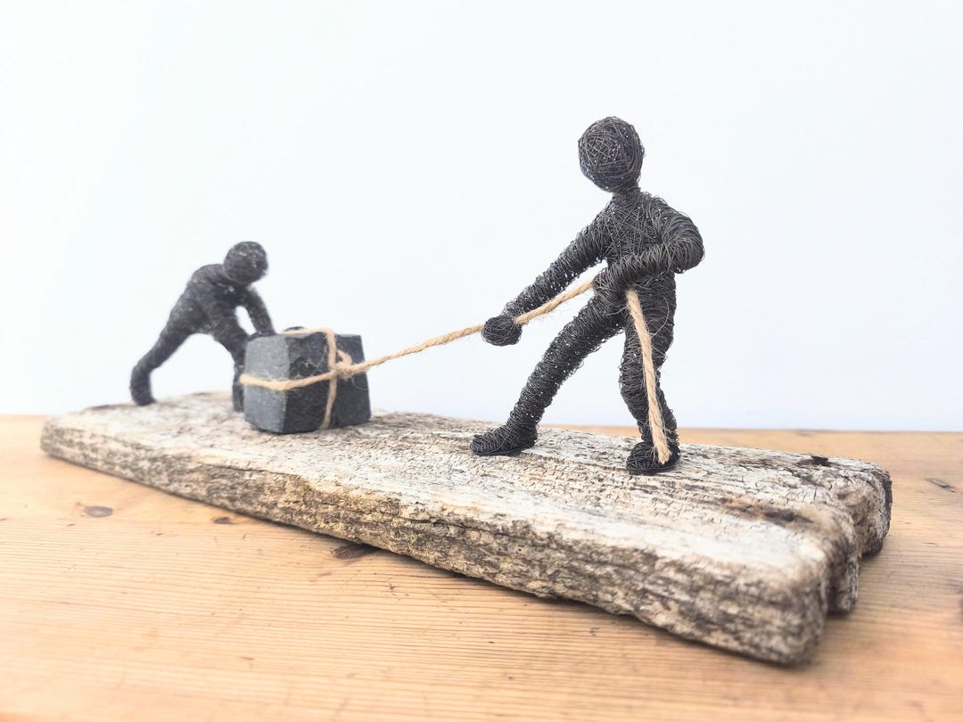 Teamwork Wire Teamwork - Wire Sculptures Move a Stone Together on a Beautiful Old ...