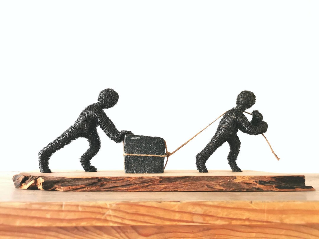 Teamwork Wire Moving the Stone Together - Teamwork - Wire Sculpture Moving a Stone on ...