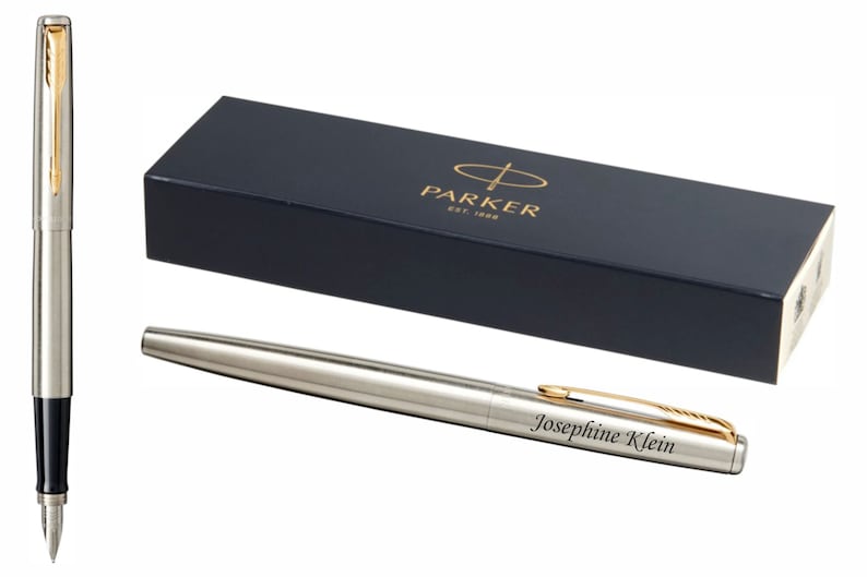 May include: A silver Parker fountain pen with a gold trim and a black ink cartridge. The pen is engraved with the name "Josephine Klein". The pen is in a black box with the Parker logo.