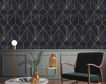 May include: A living room interior with a dark blue and gold geometric wallpaper. The room features a green velvet armchair, a round marble coffee table, and a gold pineapple on a side table.