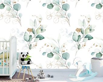 May include: A white wall with a repeating pattern of watercolor green and gold eucalyptus leaves. A white crib, a white rocking horse, and a white chair with a panda bear sitting on it are in the foreground.