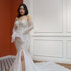 Sparkly mermaid wedding dress with side slit, structure corset bodice, and detachable long sleeve Pallas Couture inspired
