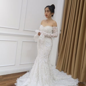 Mermaid 3D flower wedding dress with long sleeves, off the shoulder sweetheart neckline and low back for glamorous brides