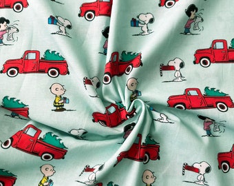 Peanuts Snoopy and Friends Christmas Cotton Red Truck on Aqua 43&quot; Wide 100% Cotton Licensed Fabric - BTY