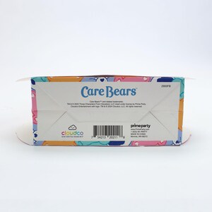May include: Care Bears box with a colorful design featuring the Care Bears characters. The box is labeled "Care Bears" and includes the text "TM & &copy; 2004 Those Characters From Cleveland, LLC Used under license by Prime Party Cloudco Entertainment with logos. TM & &copy; 2004 Cloudco, LLC. All rights reserved."