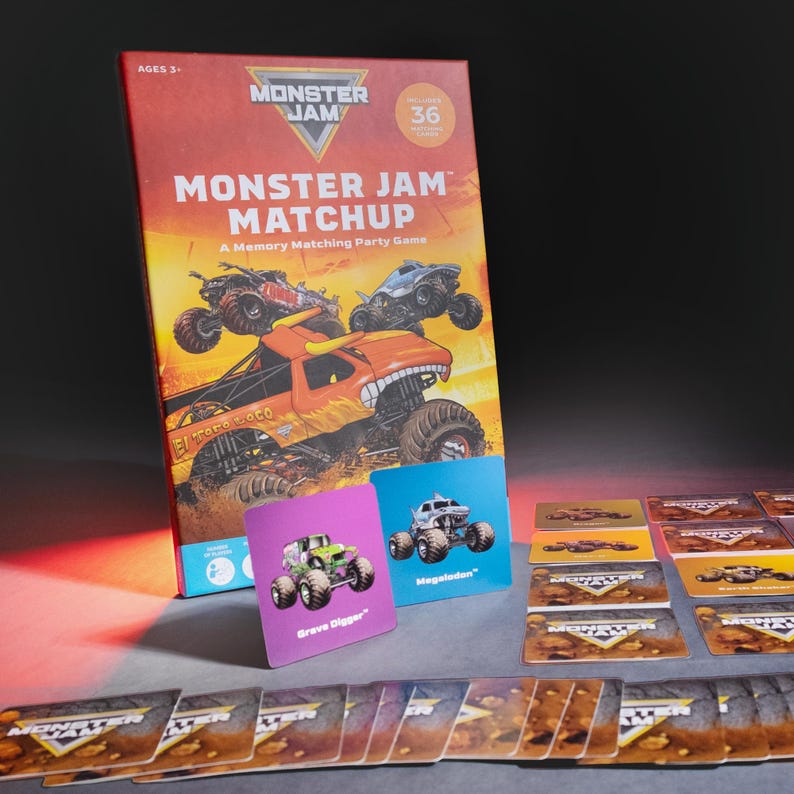 May include: A Monster Jam Matchup memory matching party game box featuring monster truck illustrations and the text "Monster Jam Matchup". Includes cards with monster truck graphics, such as Grave Digger and Megalodon.