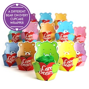 May include: Care Bears cupcake wrappers with a different bear on each wrapper. The wrappers are yellow, green, blue, orange, pink, and purple. Each wrapper has a heart with the words "Care Bears" on it.