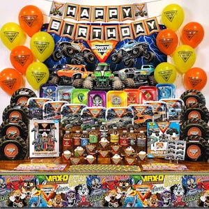 May include: A Monster Jam themed birthday party display, featuring toy trucks, balloons, plates, and a banner saying "Happy Birthday." The colour scheme includes orange, yellow, and blue, with Monster Jam branding throughout.