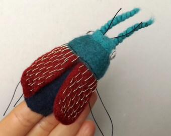 finger puppet beetle with embroidered wings