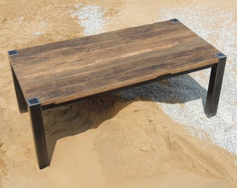 Dining table made of sliced half-timbered beams steel bargain