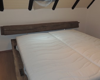 Bed made of old oak beams, historic half-timbering