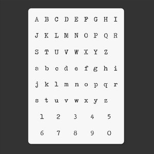 May include: A white card with black text showing the alphabet in uppercase and lowercase letters, as well as numbers 1 through 9 and the letter O.