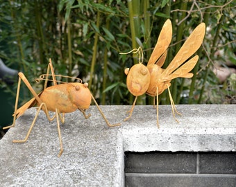 Giant ants and dragonflies as garden decorations