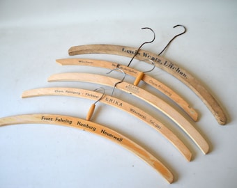 5 vintage coat hangers with advertising, F