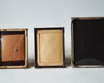 Antique photo frames in brass and with curved glass D