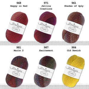 May include: Six balls of yarn in various colours, including red, burgundy, green, and yellow. Each ball has a white label with the text "Scheepjes Unity" printed on it. The yarn is arranged in two rows of three balls.