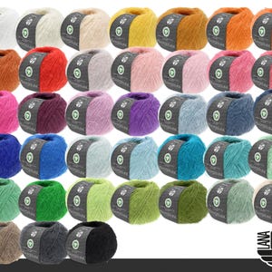 May include: A collection of thirty-five round balls of fuzzy yarn arranged in a grid, each featuring a grey paper label with the text Lana Grossa and Ecopuno. The yarn comes in a wide variety of solid colors including white, yellow, orange, red, pink, purple, blue, green, brown, grey, and black.