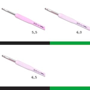 May include: Three pink crochet hooks with silver tips. The hooks are labeled 9/0 5.50mm Tulip, 10/0 6.00mm Tulip, and 10.5/0 6.50mm Tulip.
