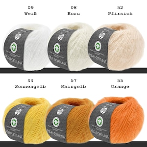 May include: Six balls of Per Fortuna yarn arranged in two rows. The top row features white, ecru, and peach colors. The bottom row displays sun yellow, corn yellow, and orange colors. Each ball has a dark gray paper label with text.
