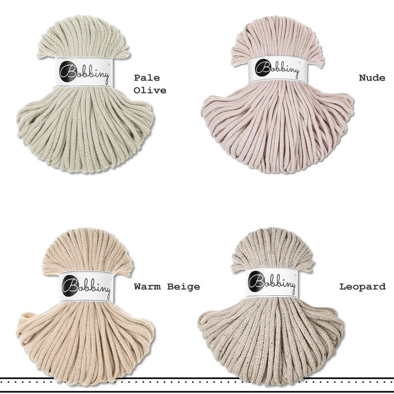 May include: Four skeins of Bobbiny cotton cord arranged in a grid. The colors are labeled as Pale Olive, Nude, Warm Beige, and Leopard. Each skein is wrapped in a white paper band featuring the Bobbiny logo in black text, showcasing the cord texture.