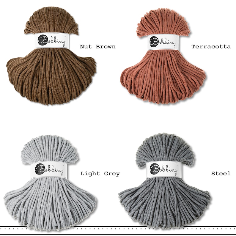 May include: Four skeins of Bobbiny cord in nut brown, terracotta, light grey, and steel colors. Each skein is wrapped in a white paper band featuring the Bobbiny logo. The cord is arranged in a fan-like shape, displaying the texture of the material.
