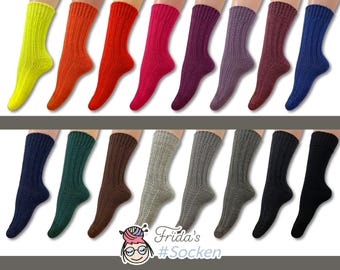 May include: A set of 20 pairs of colorful ribbed socks. The socks are displayed on a white background. The socks are all the same style, but they are in different colors, including yellow, orange, red, pink, purple, blue, green, brown, gray, and black.