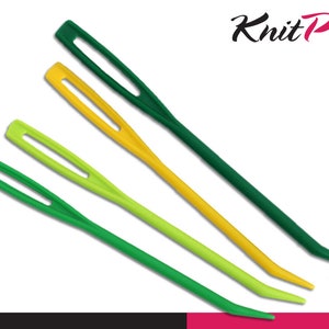 May include: Four plastic yarn needles in green, yellow, and lime green. The needles are all the same size and shape, with a small eye at one end and a pointed tip at the other. The needles are made by Knit Pro.