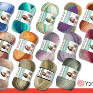 Könnte beinhalten: Sortiment von Garnknäuel in verschiedenen Farbkombinationen, darunter Blau, Grün, Orange, Lila, Rosa und Grau. Jedes Knäuel hat ein mehrfarbiges Verlaufsmuster. Das Garn ist mit "YarnArt ANDORA ACTIVE" gekennzeichnet.