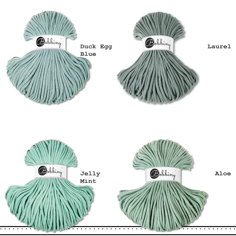 May include: Four skeins of Bobbiny cotton cord arranged in a grid. The colors are labeled Duck Egg Blue, Laurel, Jelly Mint, and Aloe. Each skein is secured with a white paper band featuring the Bobbiny logo in black script text.
