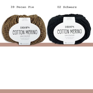 May include: Two skeins of Drops Cotton Merino yarn. One is a brown color labeled "39 Pecan Pie", the other is black and labeled "02 Schwarz". Each skein has a white label with the text "DROPS COTTON MERINO UNI COLOUR A superwash yarn for all seasons".