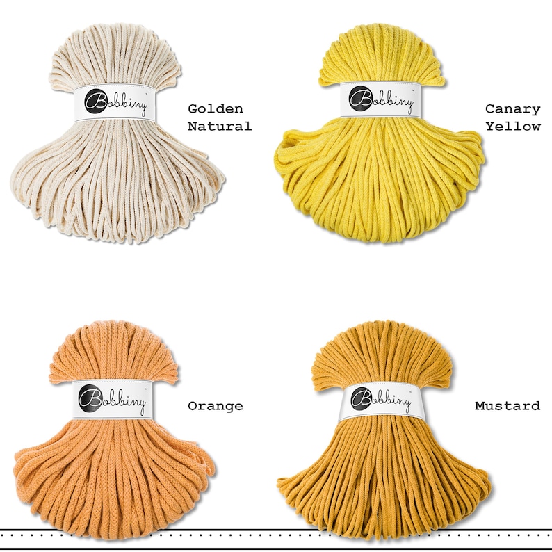 May include: Four skeins of Bobbiny cotton cord arranged in a grid. The colors are labeled as Golden Natural, Canary Yellow, Orange, and Mustard. Each skein is secured with a white paper band featuring the Bobbiny logo in black script text.