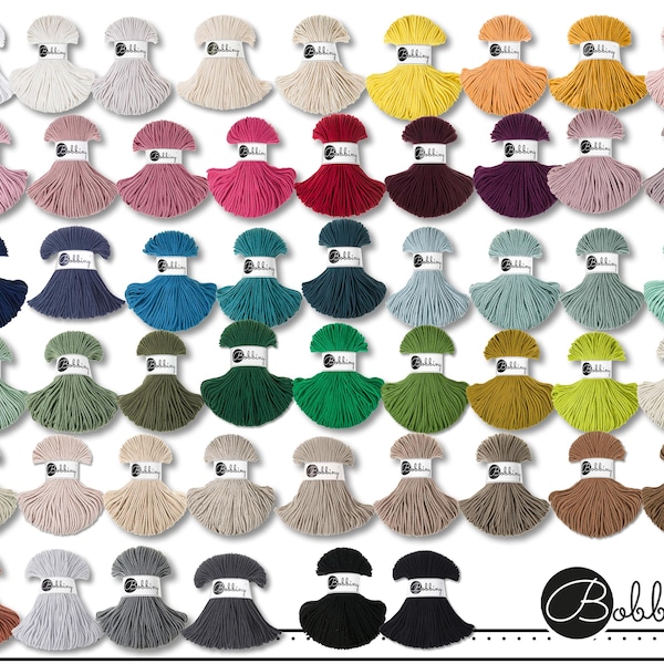 May include: A collection of fifty-two individual skeins of cord arranged in a grid, each featuring a white paper label with the text Bobbiny. The cords are displayed in a wide variety of solid colors, including white, gray, pink, red, blue, green, and brown.