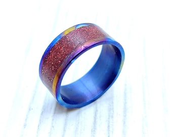 Glowing Red Glitter On Blue Titanium Ring - UV-Luminous Cyberpunk Jewelry. Green VS Red ring
