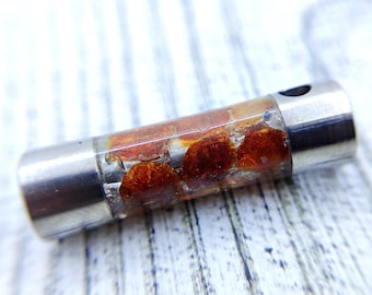 Baltic Amber Inlaid Titanium Pendant - A Tribal Necklace Infused with the Enigmatic Beauty of Amber