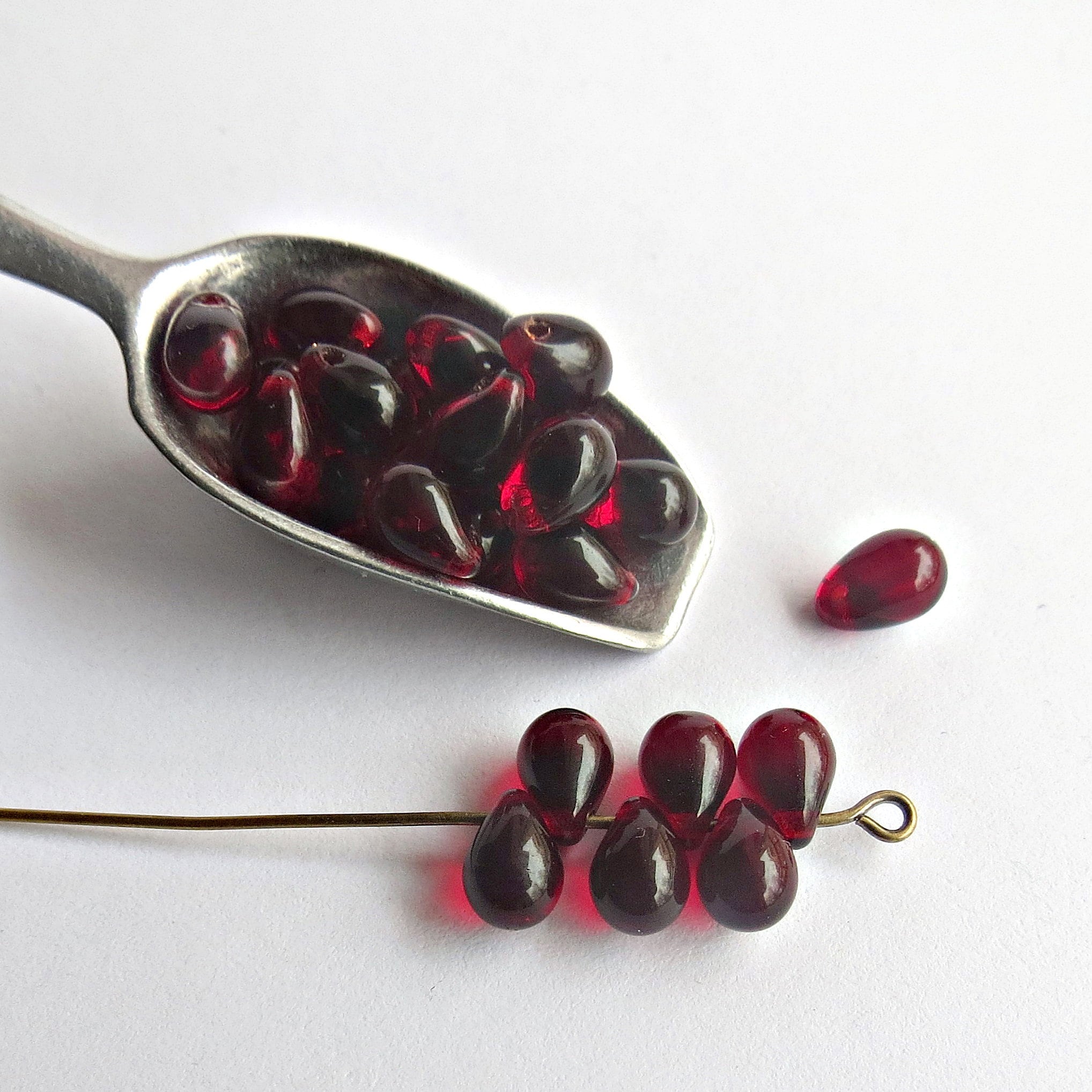 Ten large Czech glass teardrop beads - 9 x 18mm transparent Siam red  pressed glass side drilled faceted drops six sides C0054
