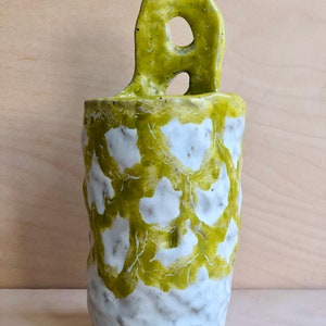 one handmade yellow mesh vase from Yoko Iida Studio
