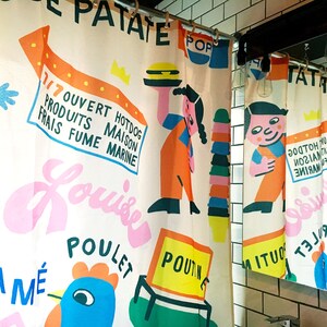 Shower curtain designed by canadian artist Vincent Toutou, with fun and colourful unique cartoon patterns, for Costume de bain in Montreal.