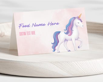 May include: A folded card with a watercolor background in shades of pink. The card features a white unicorn with a blue and purple mane and tail, and a golden horn. The text "Food Name Here" and "CUSTOM TEXT HERE" are displayed on the card.