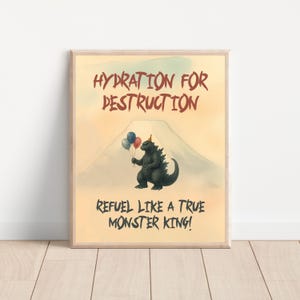 May include: A framed print with the text "HYDRATION FOR DESTRUCTION" and "REFUEL LIKE A TRUE MONSTER KING!". The image features a Godzilla-like monster holding balloons in front of a mountain.