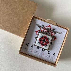 May include: A set of three ceramic mugs with a speckled, matte finish. The mugs are in shades of cream, light grey, and dark grey. Each mug has a simple, minimalist design, ideal for coffee or tea.