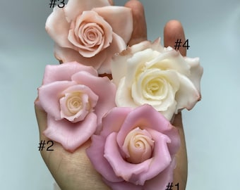 May include: Four handmade fabric roses in different shades of pink and white. The roses are numbered 1 through 4.