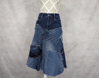 May include: A denim skirt made from different pieces of blue denim, with a patchwork design. The skirt has a flared silhouette and a raw hem.