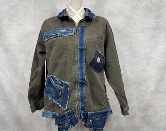 May include: An olive green jacket with denim patches and accents. The jacket has a zip closure and various denim patches sewn onto the front and sleeves. The collar and centre front are trimmed with denim.