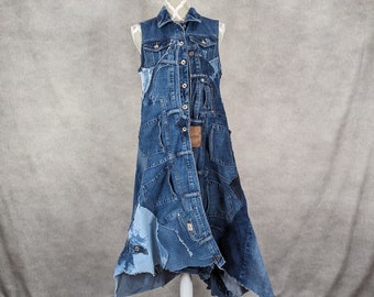 May include: A long denim vest made from repurposed denim. The vest has a patchwork design with different shades of blue denim and features a button closure.