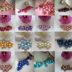 May include: Assortment of 12 colors of pearl beads, each color shown in a separate square. The beads are round and have a smooth, glossy finish.