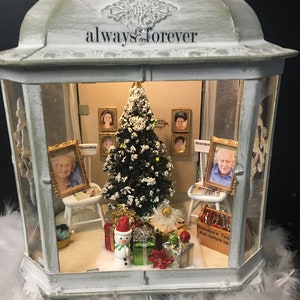 Christmas memorial lighted  lantern memorial for two, lighted Christmas tree, gifts, photos of family,