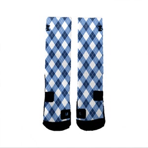 May include: A pair of blue and white argyle patterned socks with black accents.
