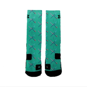 May include: A pair of teal athletic socks with a geometric pattern and black accents. The socks have a black strap on the ankle and the letters "L" and "R" are printed on the bottom of each sock.